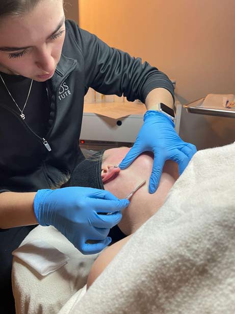 This is an image of a Woman having a Hydrafacial Session at Confident MedSpa.